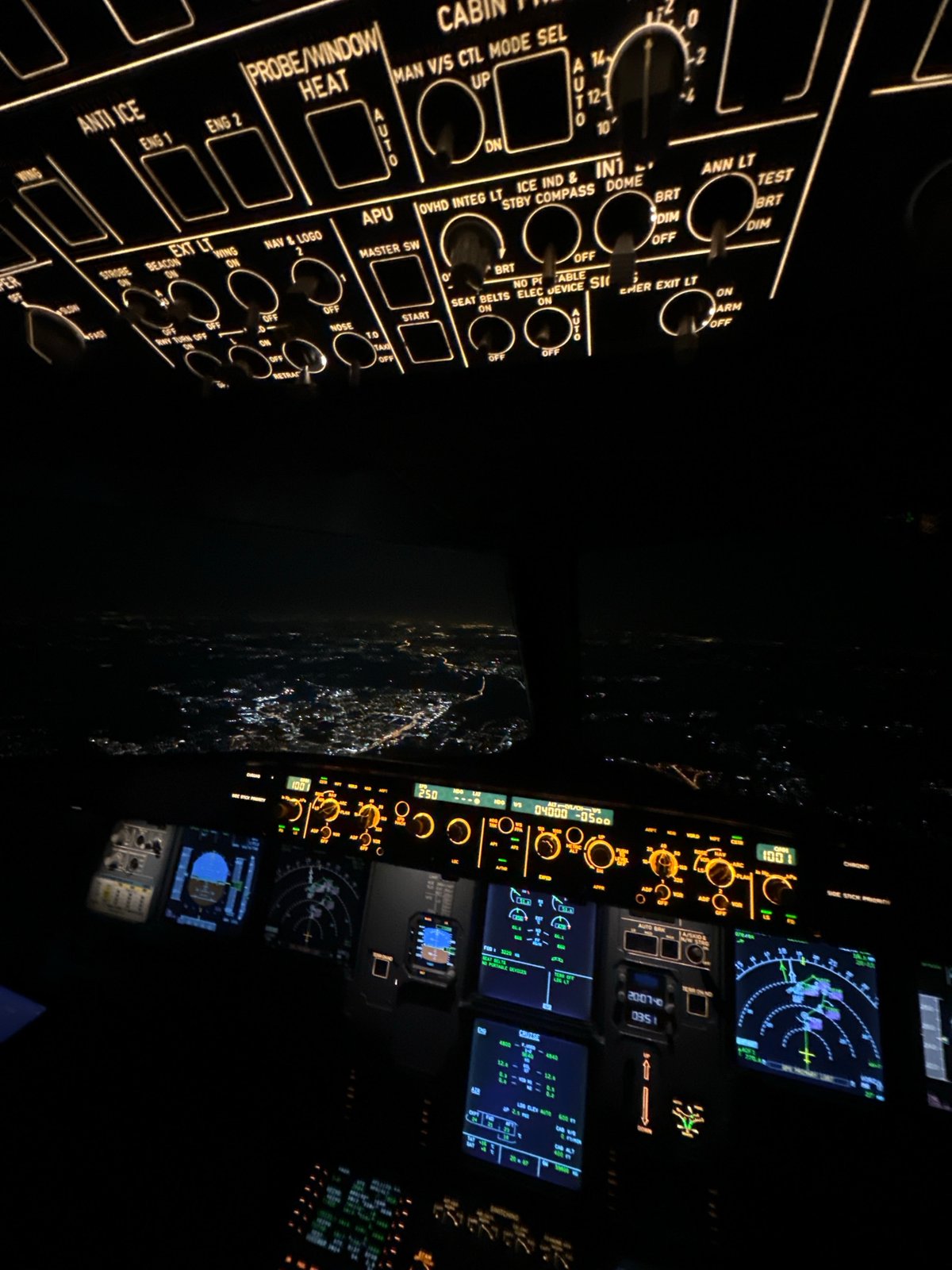 Aircraft cockpit documented during nighttime flight operations over Khimki