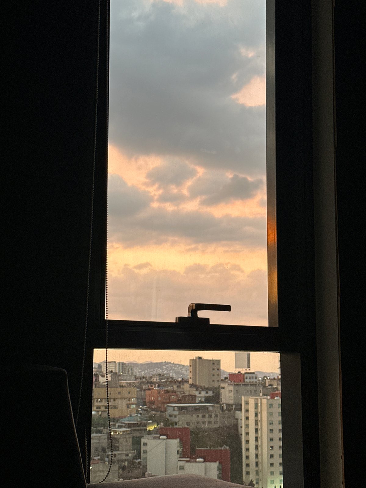 Golden clouds observed through window in Huixquilucan, Mexico