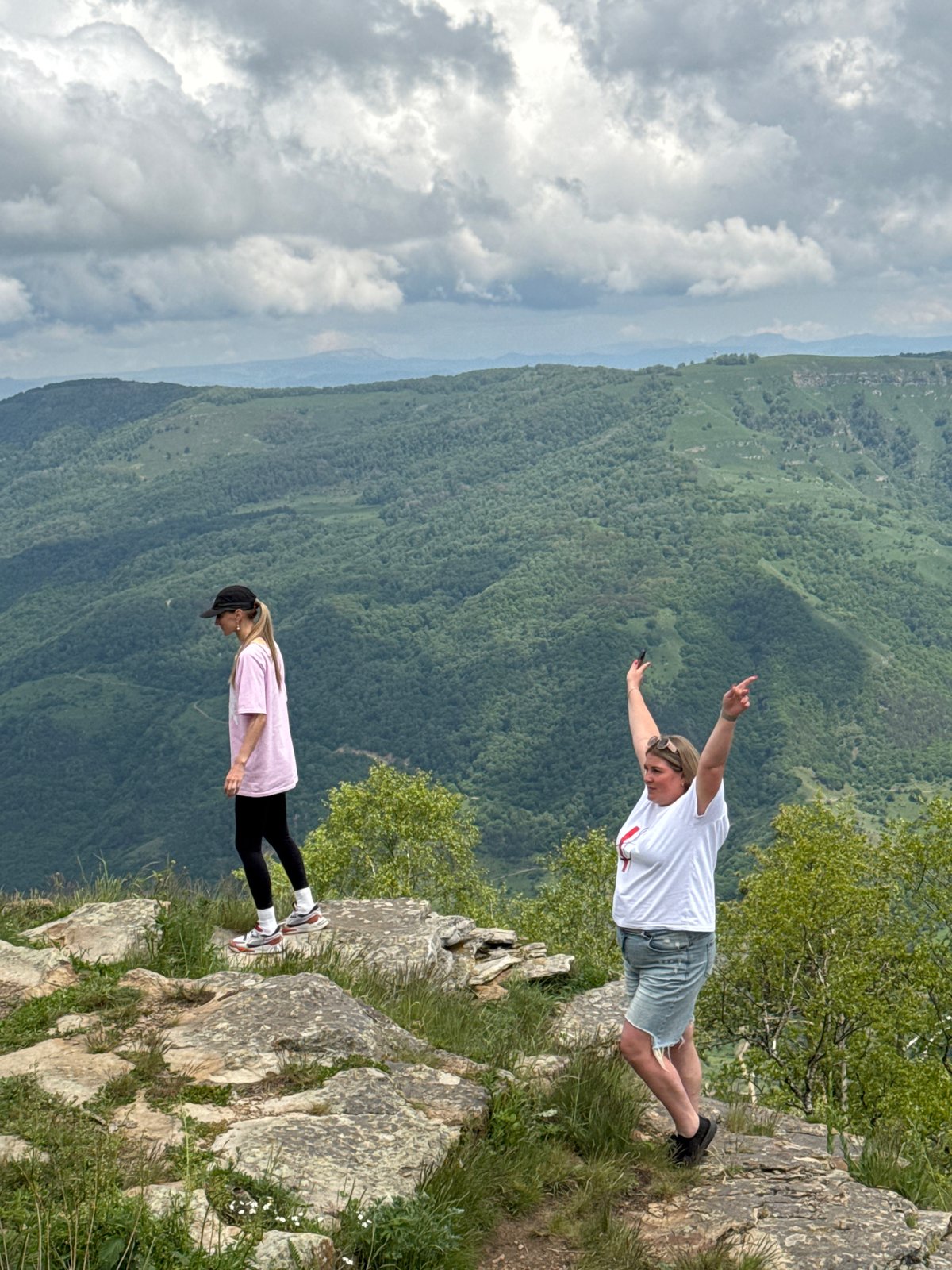 Tourists explore Russian mountain region via off-road vehicles, campfires