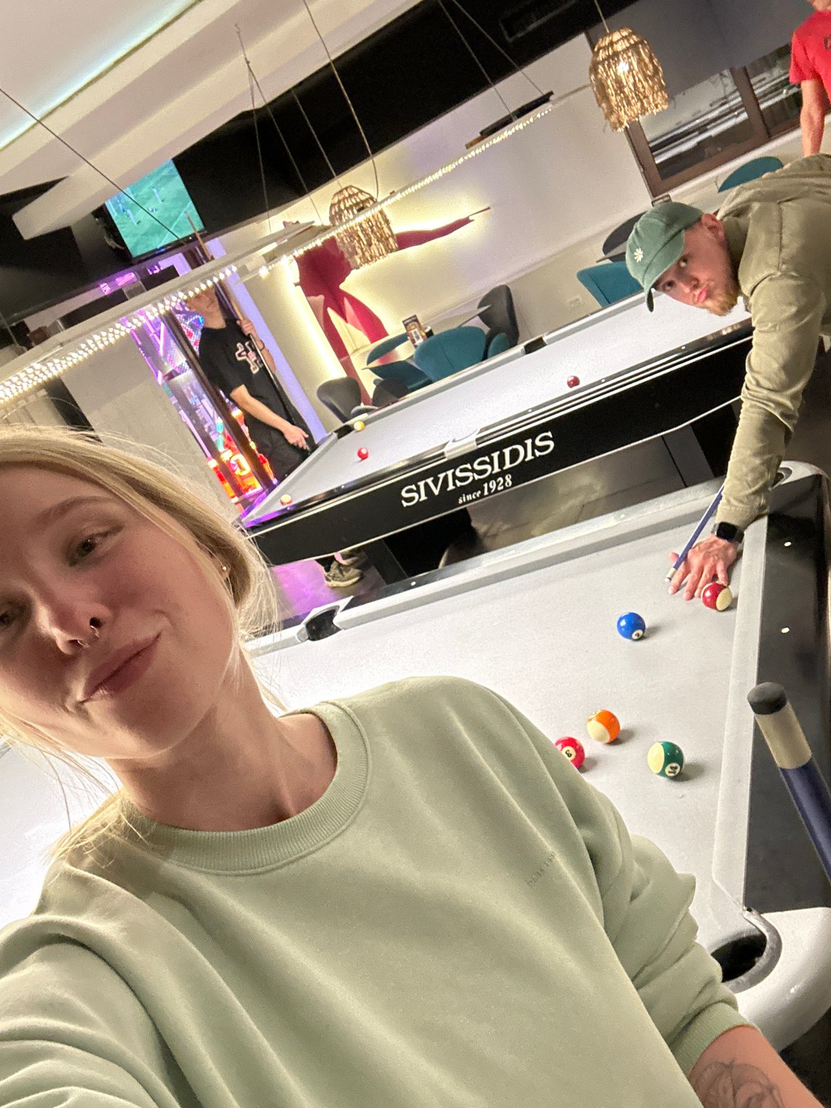 Woman takes selfie at bar in Budva, Montenegro