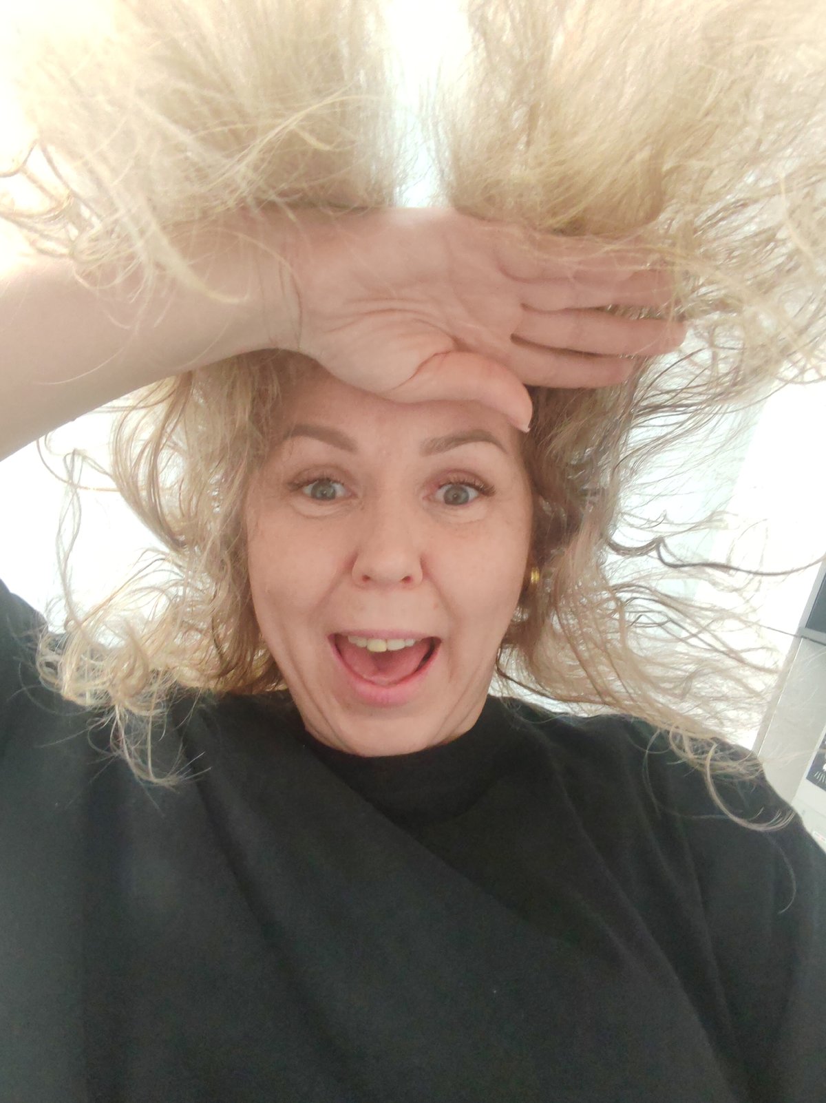 Blonde woman photographed in multiple poses in Chaikovsky, Russia