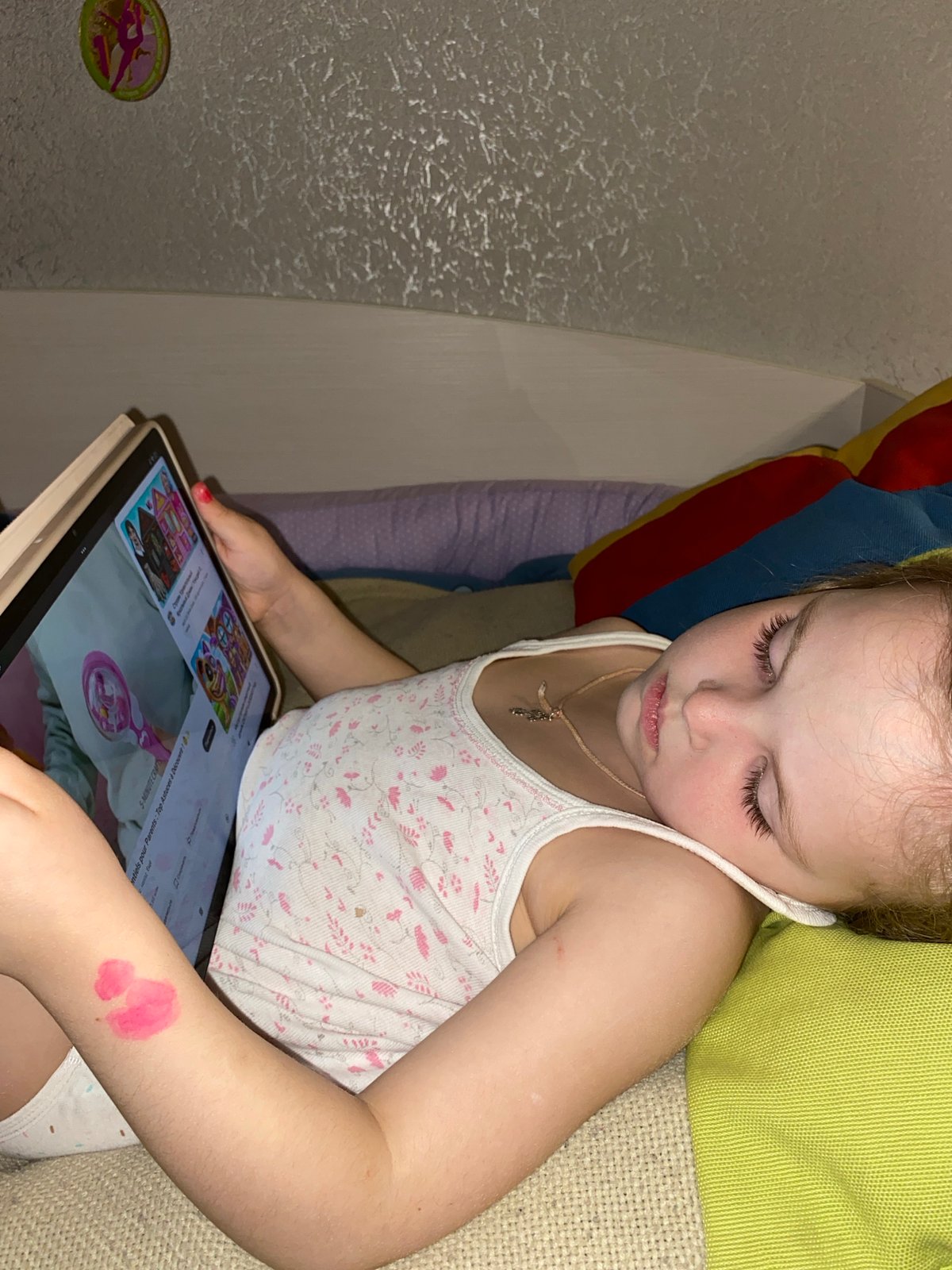 Young girl uses tablet at home in Votkinsk, Russia