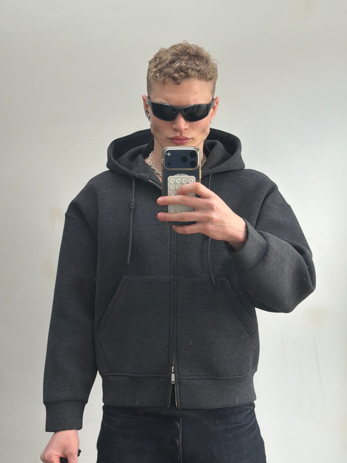 Person takes selfie against wall in London