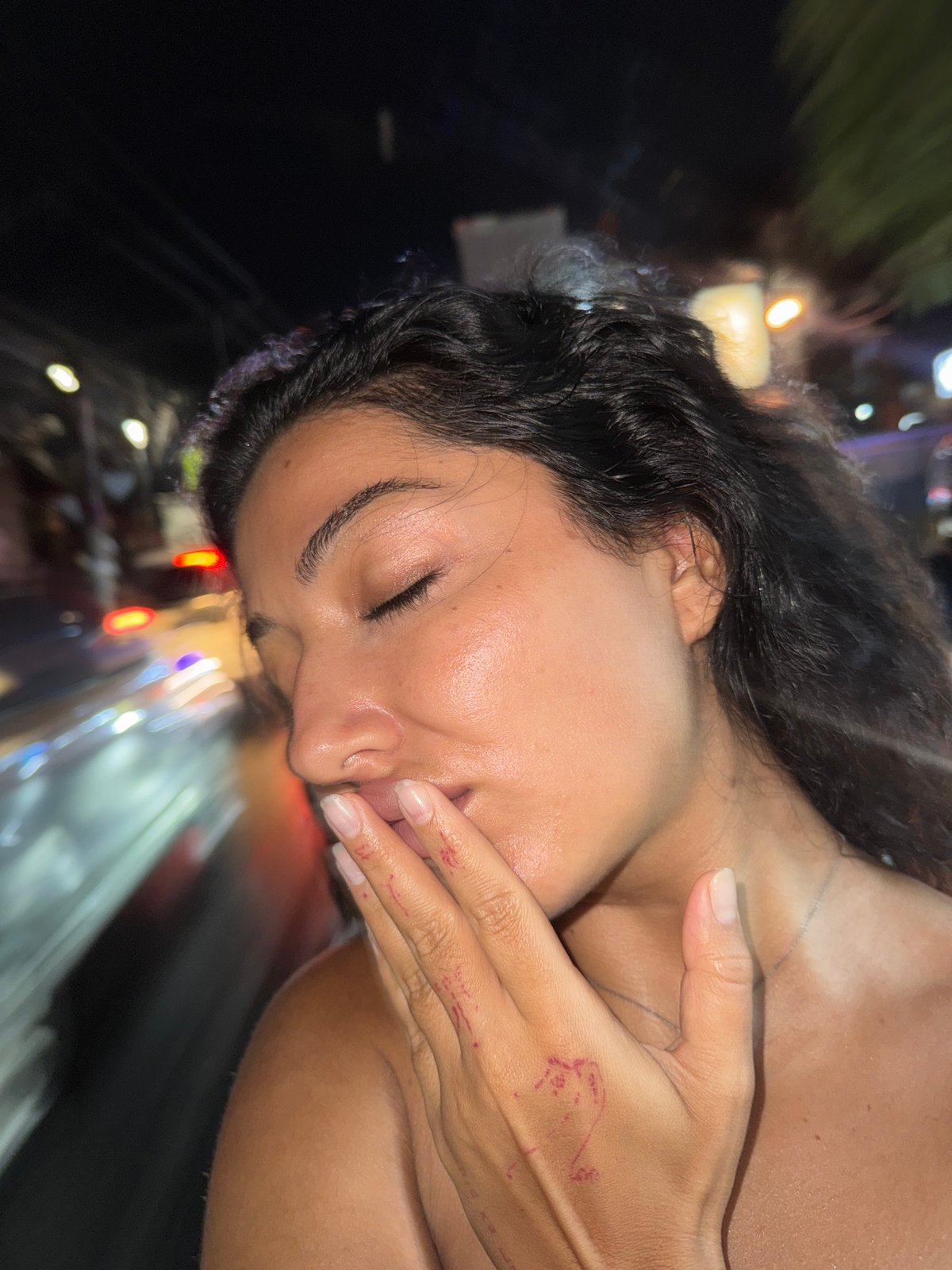 Couple takes nighttime selfies in North Kuta after rain