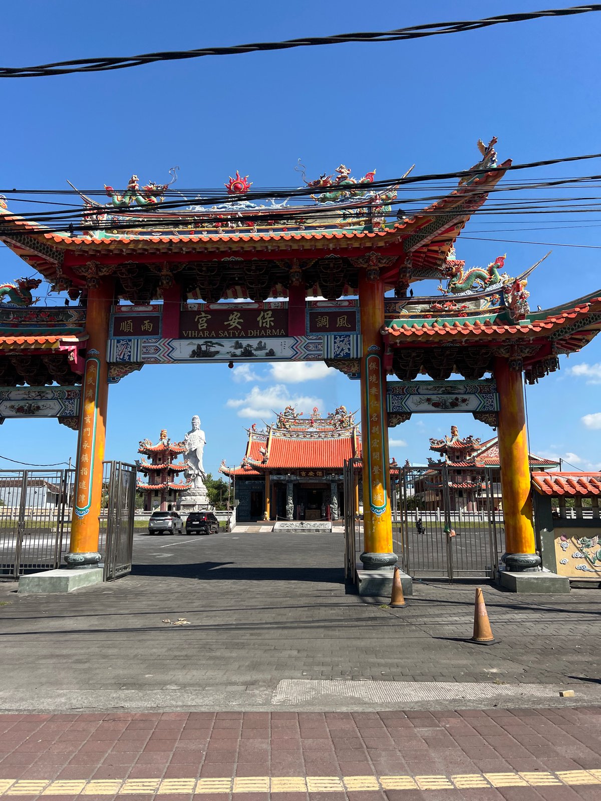 Ornate dragon archway marks Denpasar's Vihara Satya Dharma temple entrance