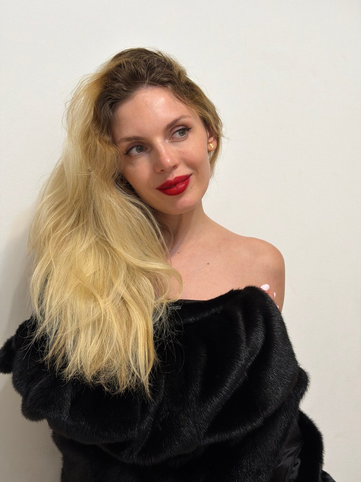 Photo session documented in Budva featuring woman in fur coat