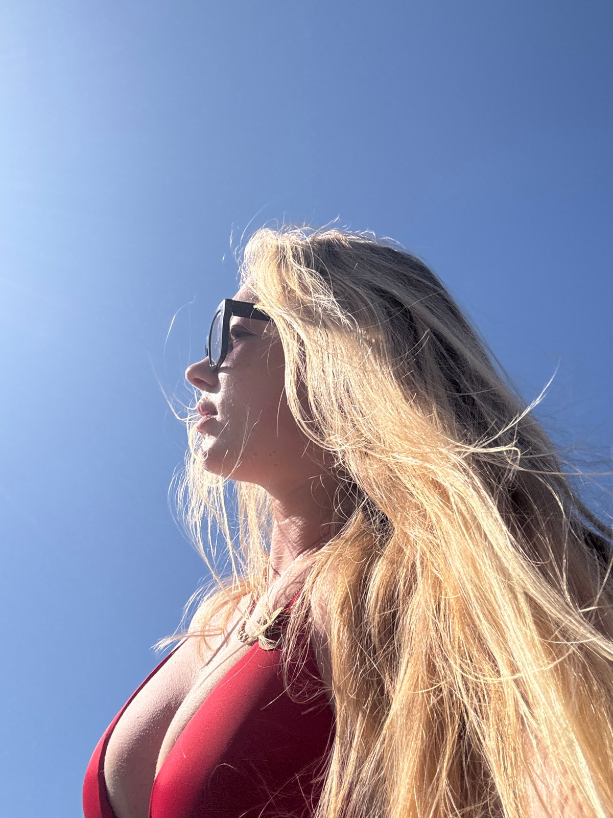 Woman photographed against blue sky in Herzliya