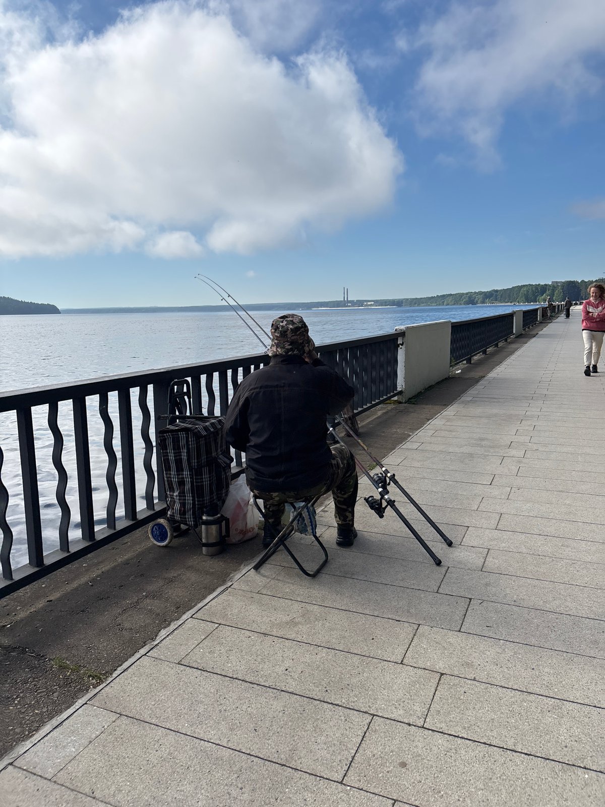 Fishing from the promenade on a calm Chaikovsky morning