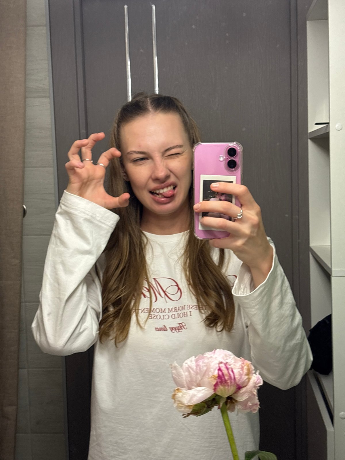 Mirror selfies in a Perm bathroom, pink phone and peonies