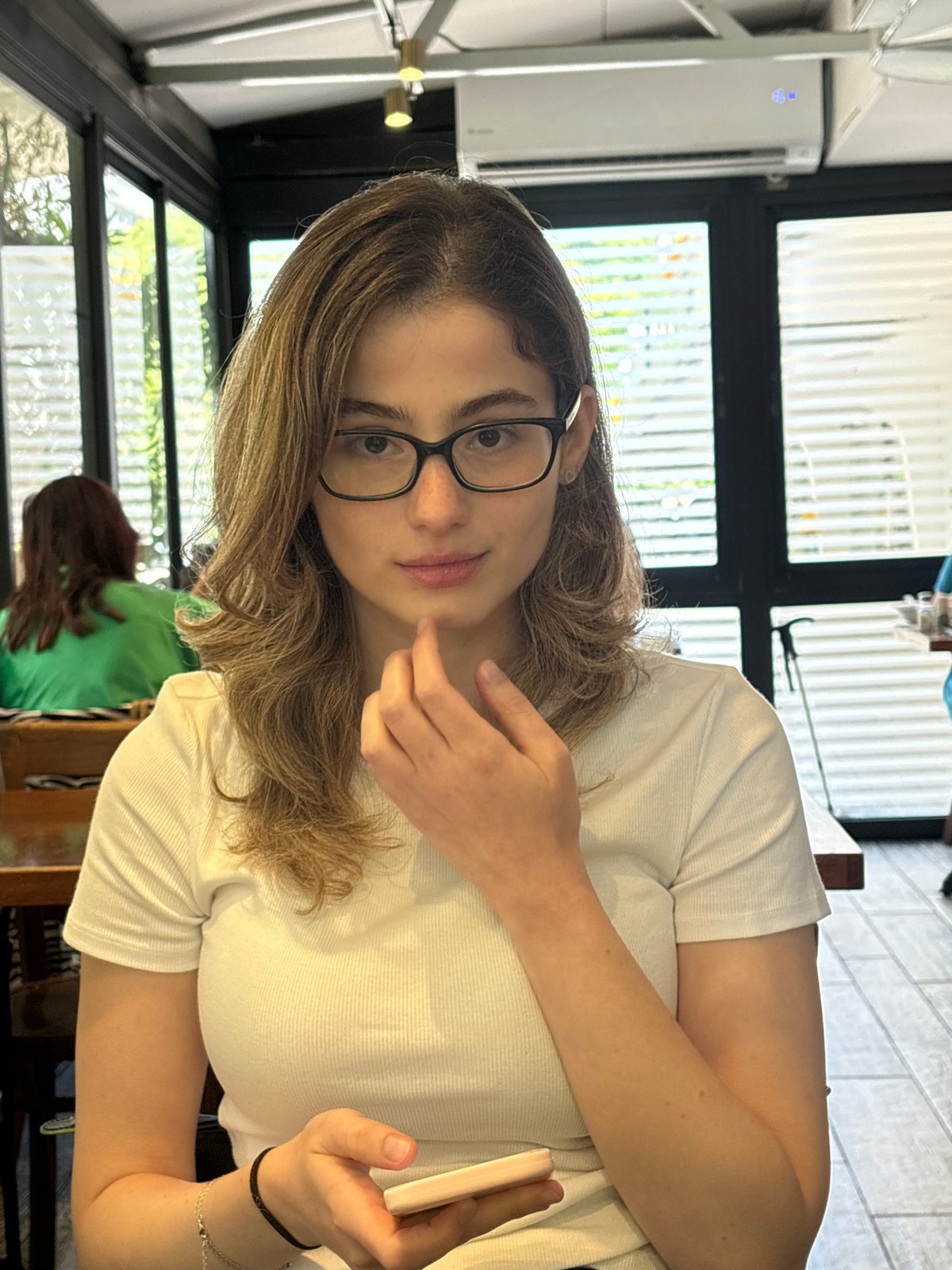 Cafe moment in Tel Aviv, phone in hand