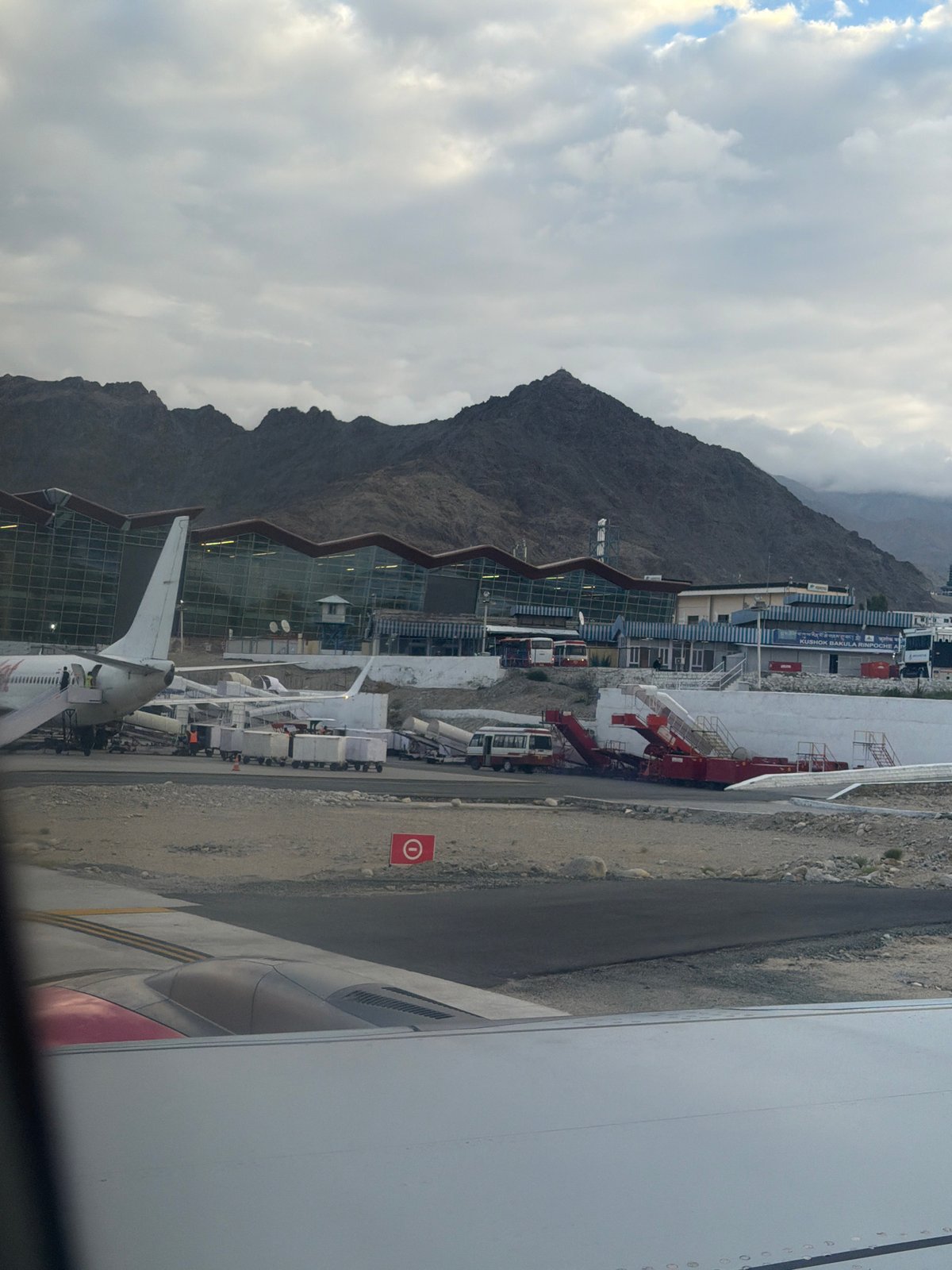 SpiceJet on the tarmac at Leh Airport, Himalayas behind