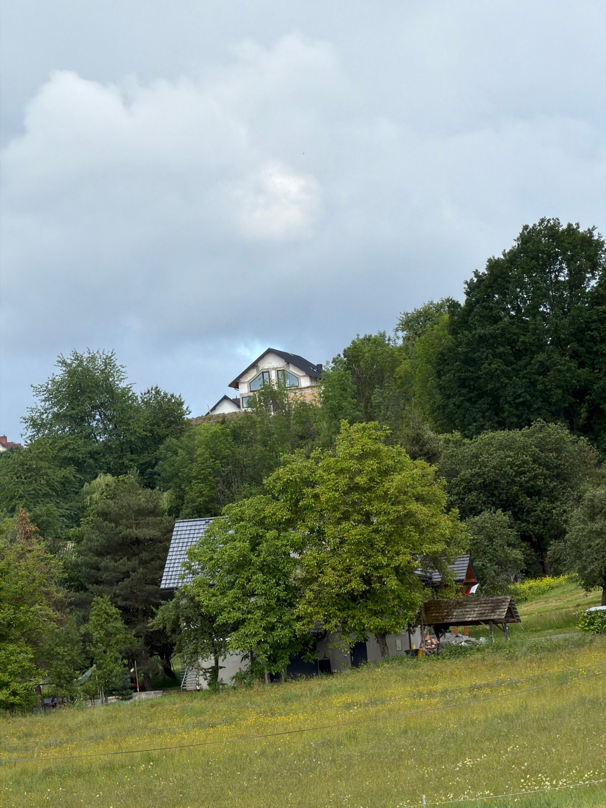 Construction work proceeds under stormy skies in rural Poland
