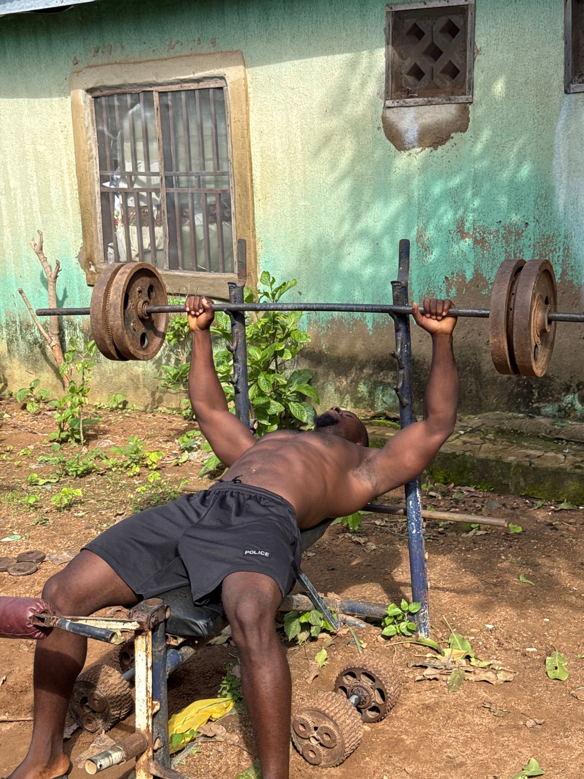Outdoor weightlifting session at a makeshift gym in Akwanga