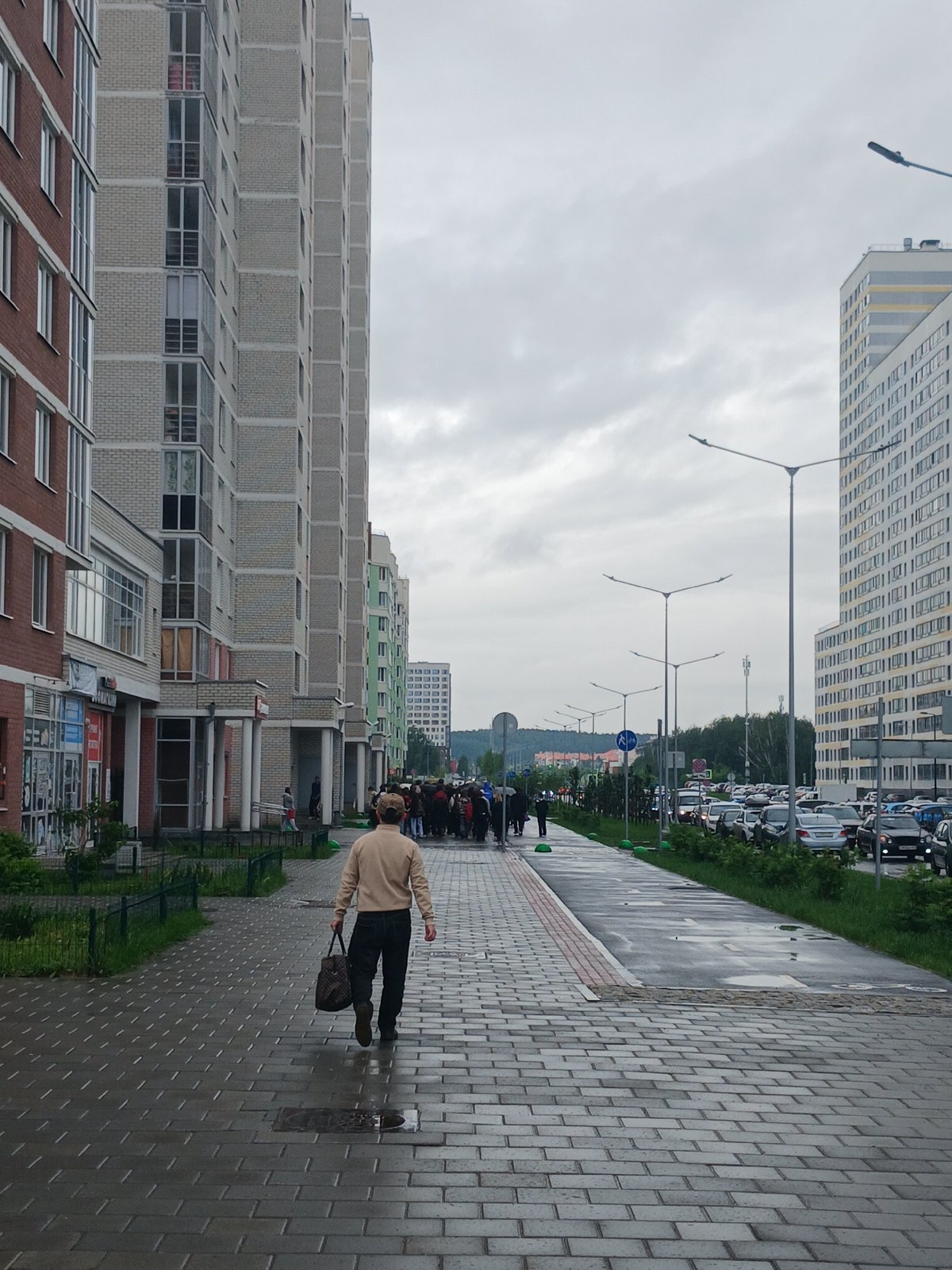 Rain-soaked morning street life documented across Yekaterinburg
