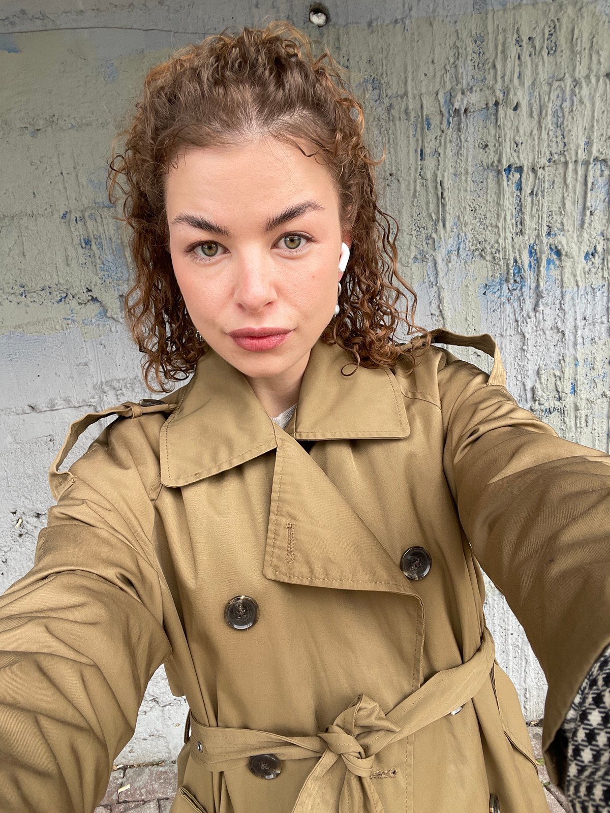 Woman takes selfies at Montenegro beach overlook