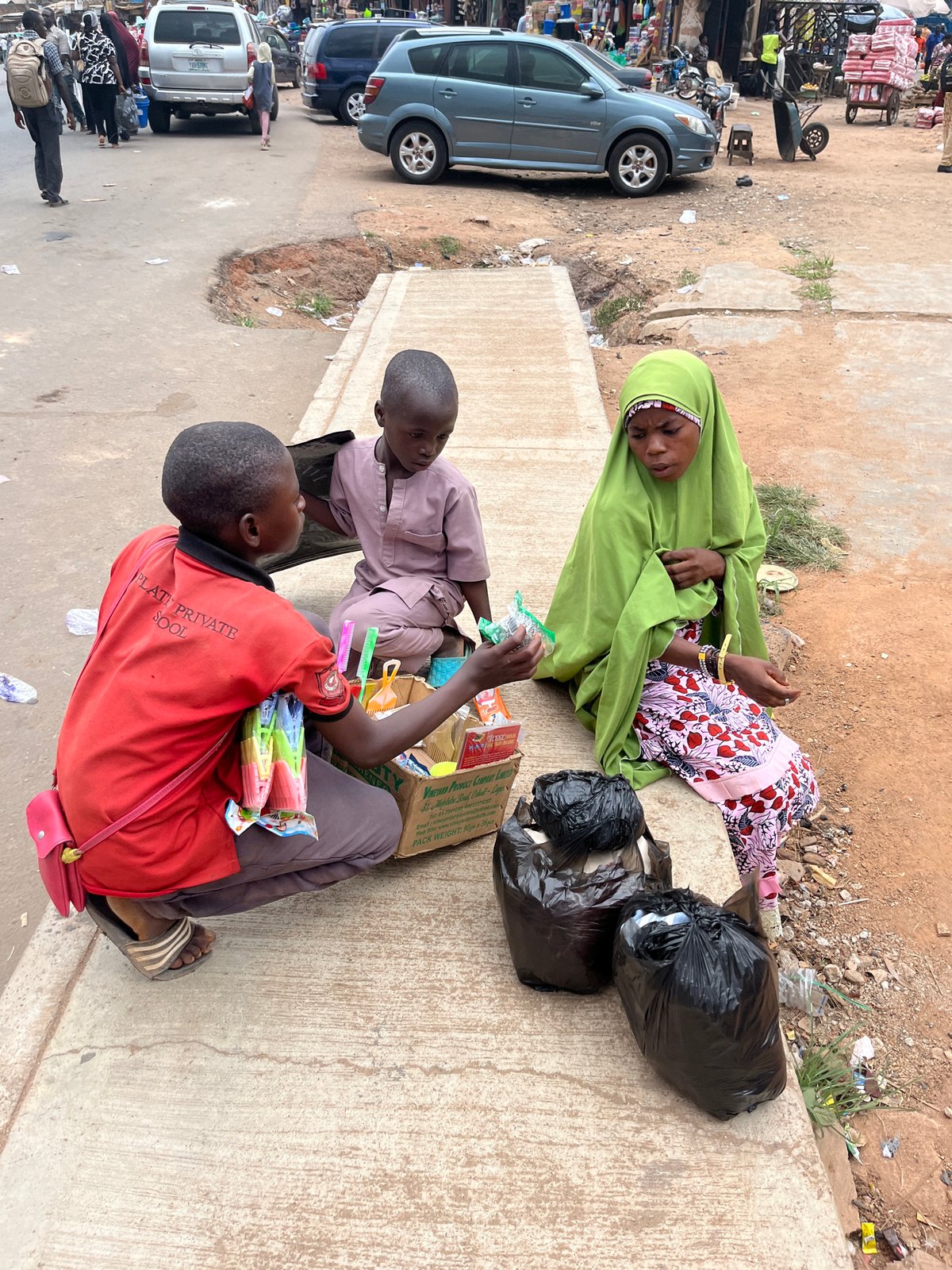 Daily street life documented across Jos, Nigeria during midday hours