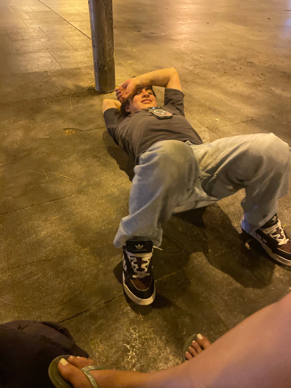 Late-night street hangout on a city plaza