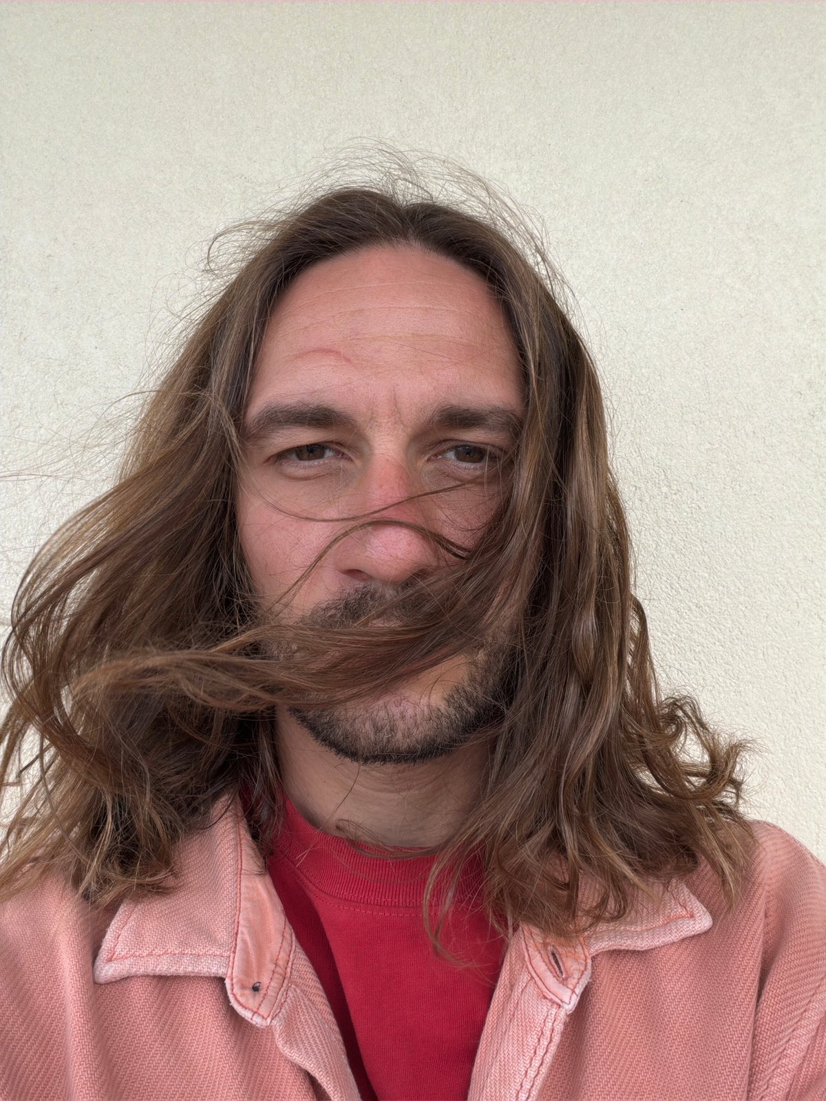 Bearded man in pink clothing observed in Pokhara, Nepal