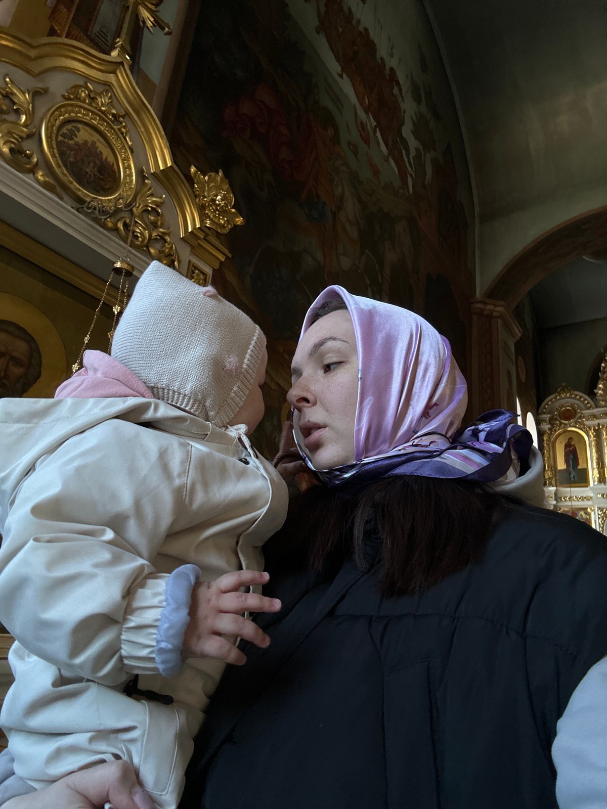 Family visits Eastern Orthodox church during morning hours