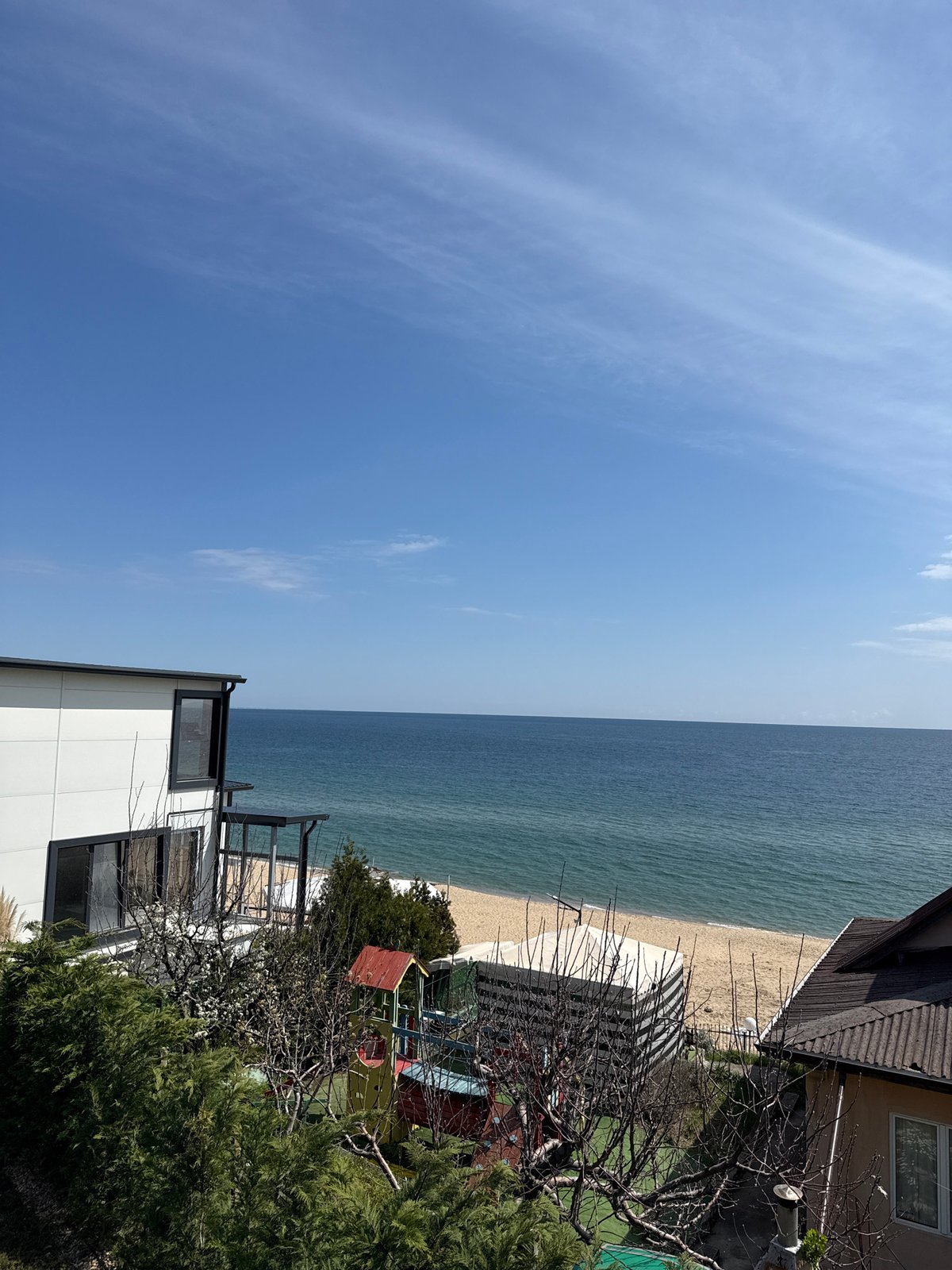 Beach scene documented in Varna, Bulgaria showing residential development