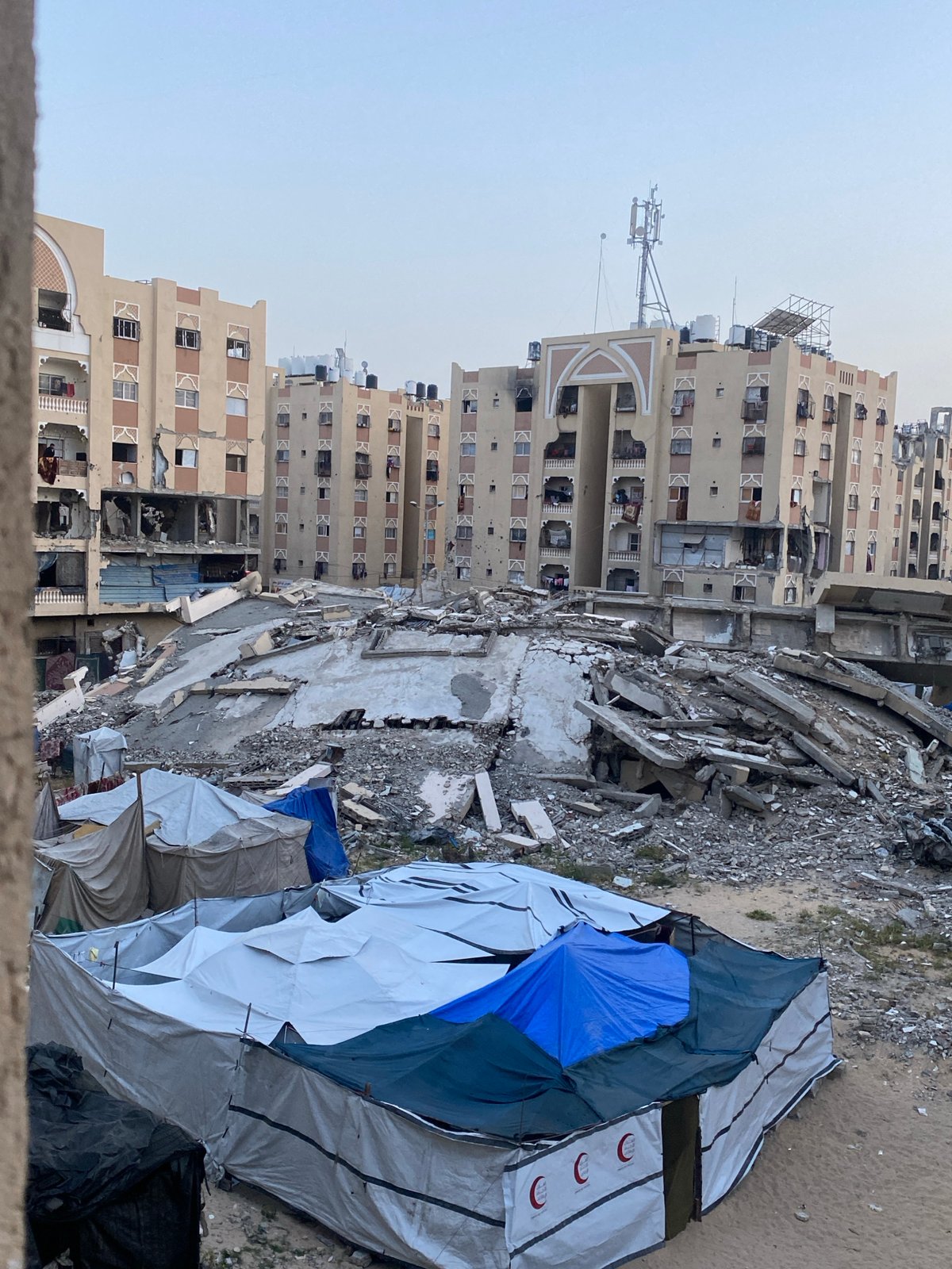 Khan Yunis families displaced, children play amid destruction