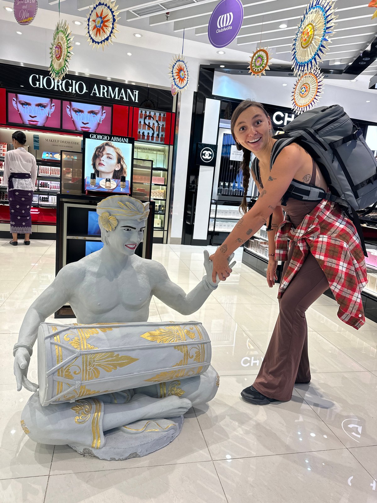 Late-night tourist activity documented at Bali's international airport