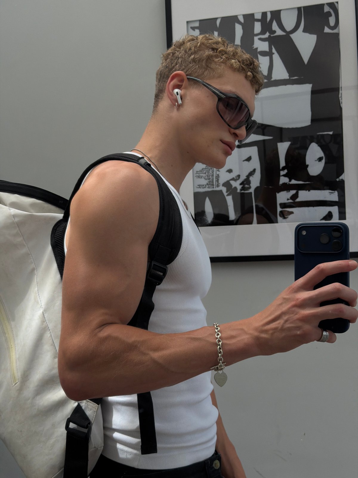 Mirror selfies in a London fitting room, same outfit, multiple angles.