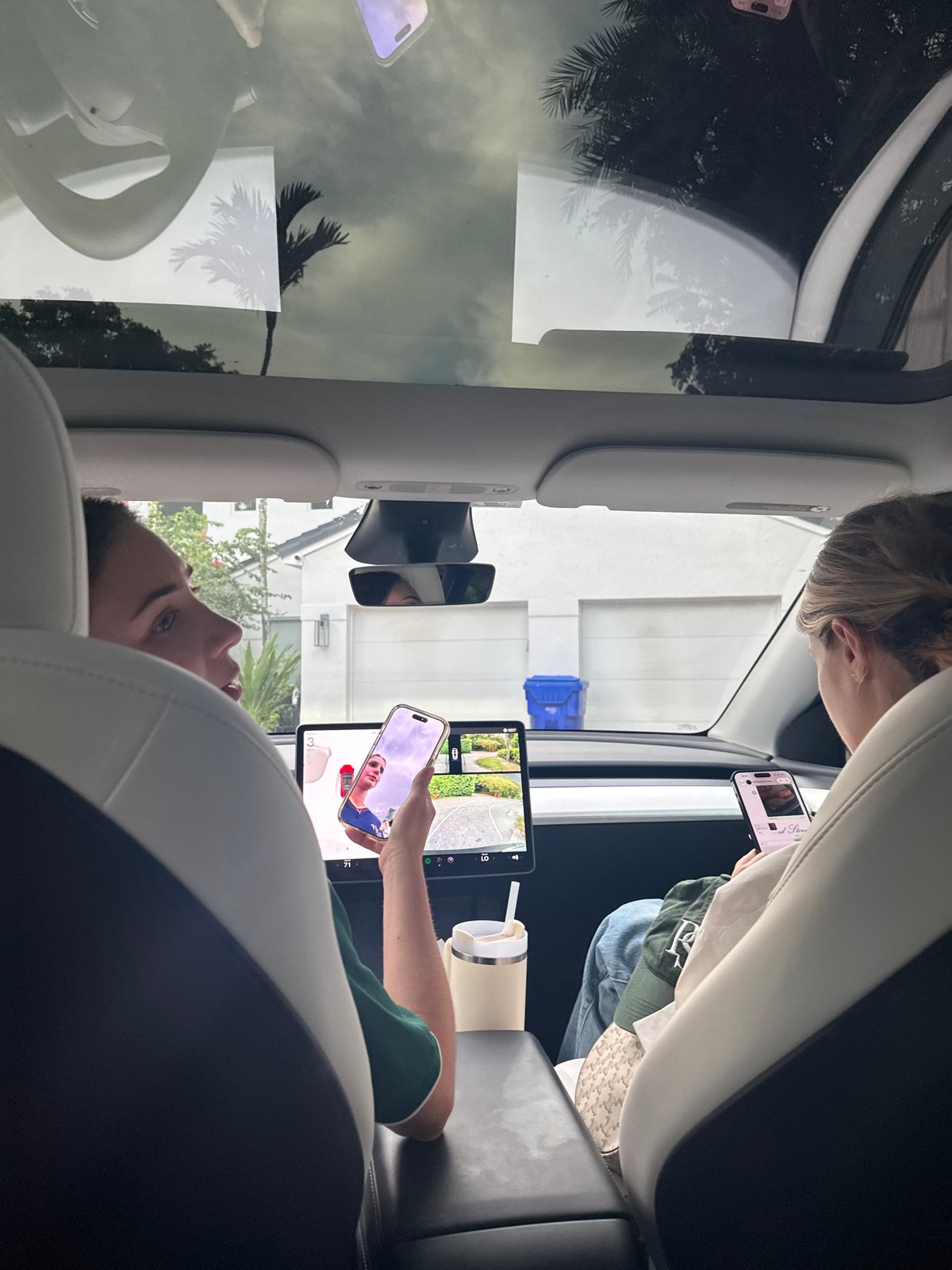 Passengers inside a Tesla, Miami night