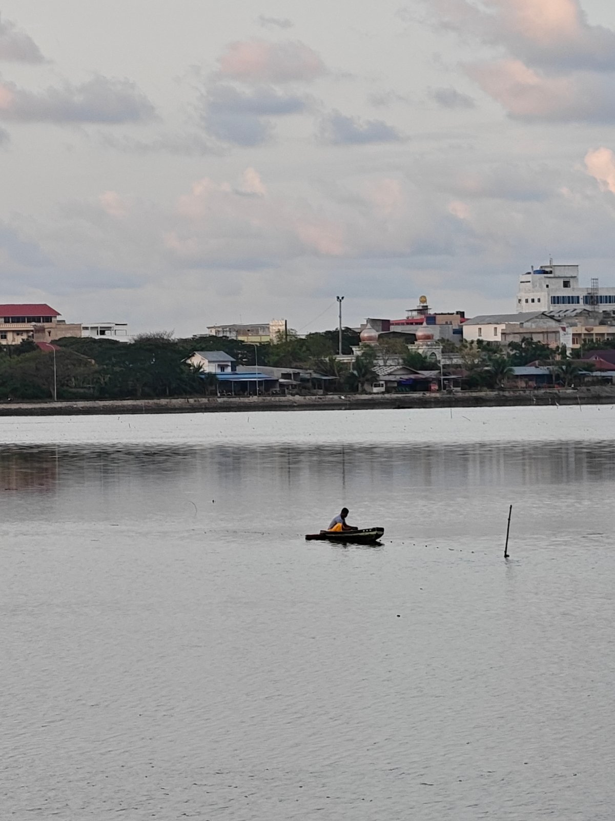 Evening fishing and sunset captured in Lhokseumawe waterway