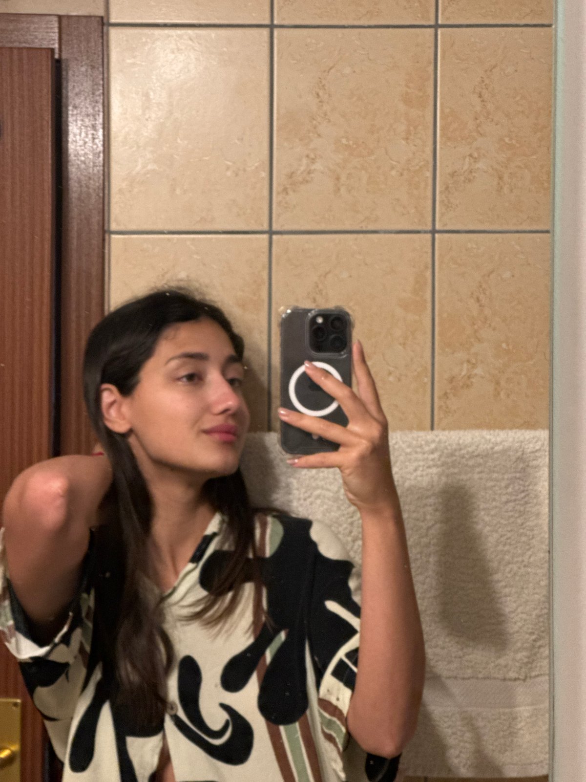 Woman takes bathroom selfie in Montenegro village
