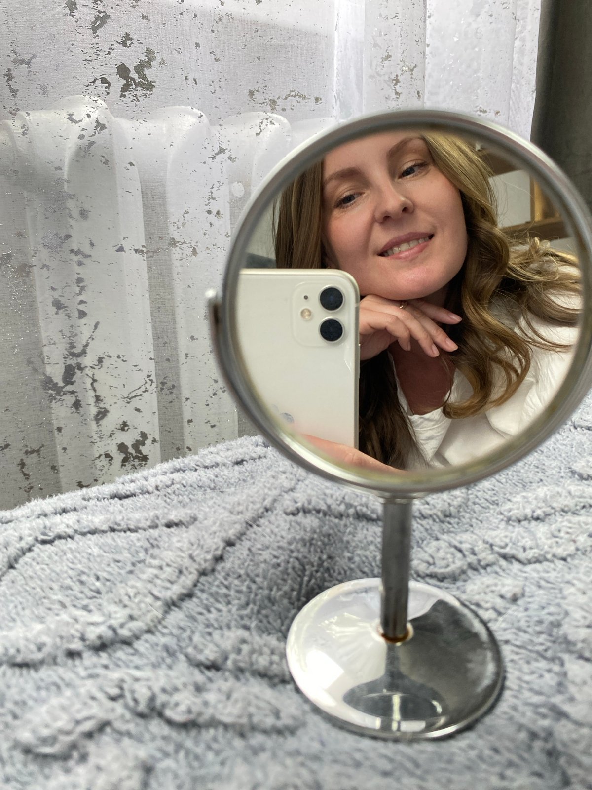 Woman takes mirror selfies in Noviy, Russia morning routine