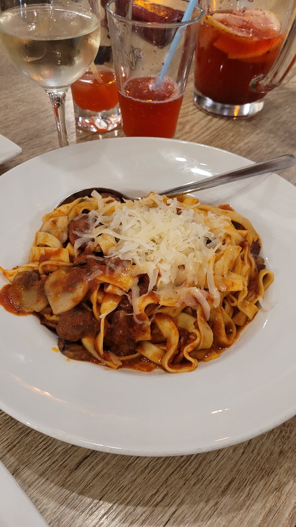 Diners document pasta and pizza meals in Varna restaurant