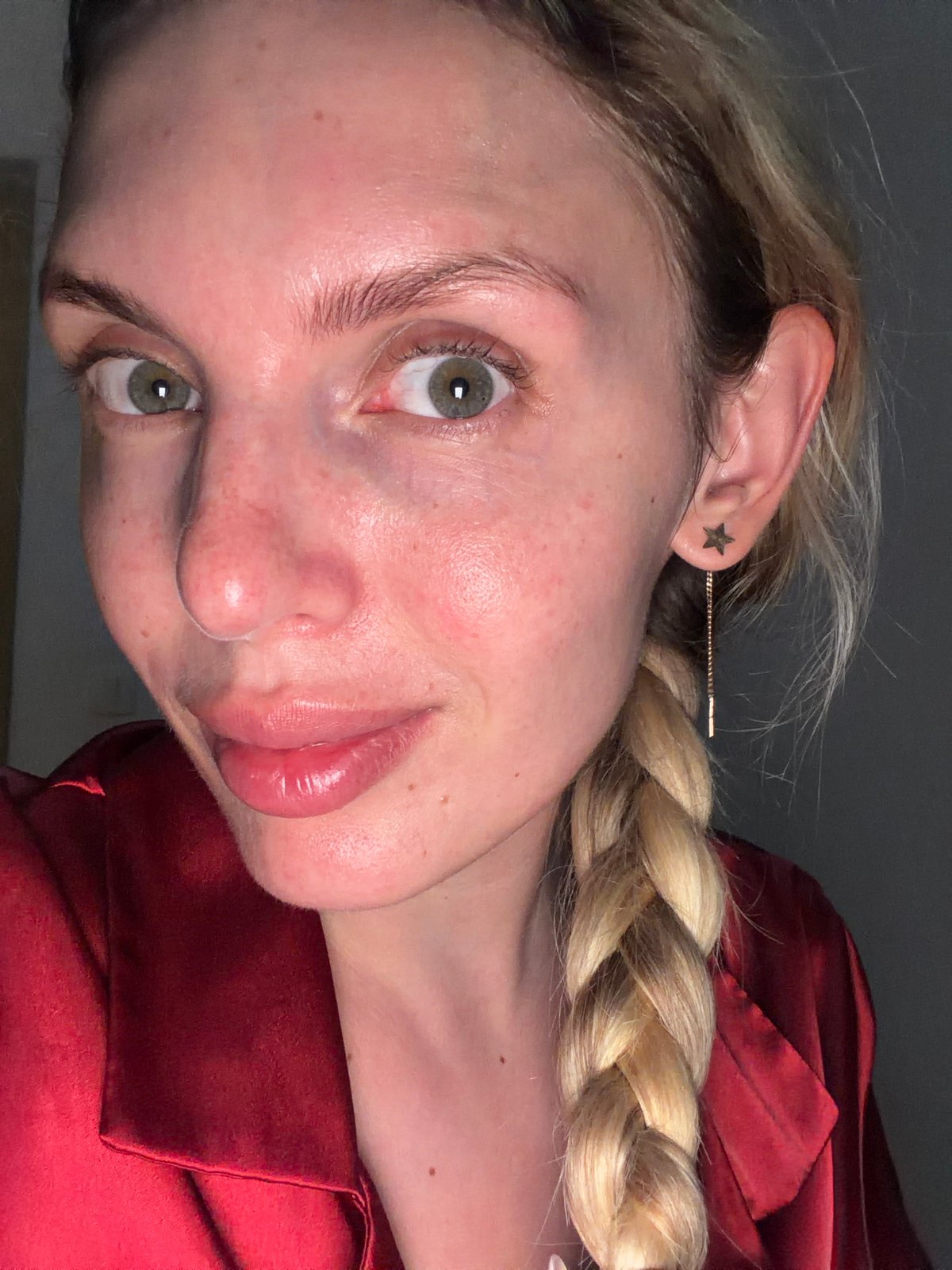 Woman applies skincare routine in Budva Montenegro evening