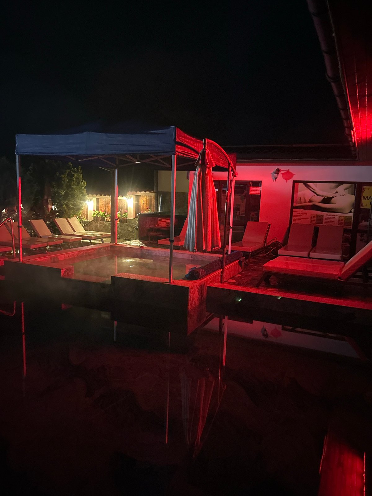 Empty thermal spa glows red at night in Bulgaria