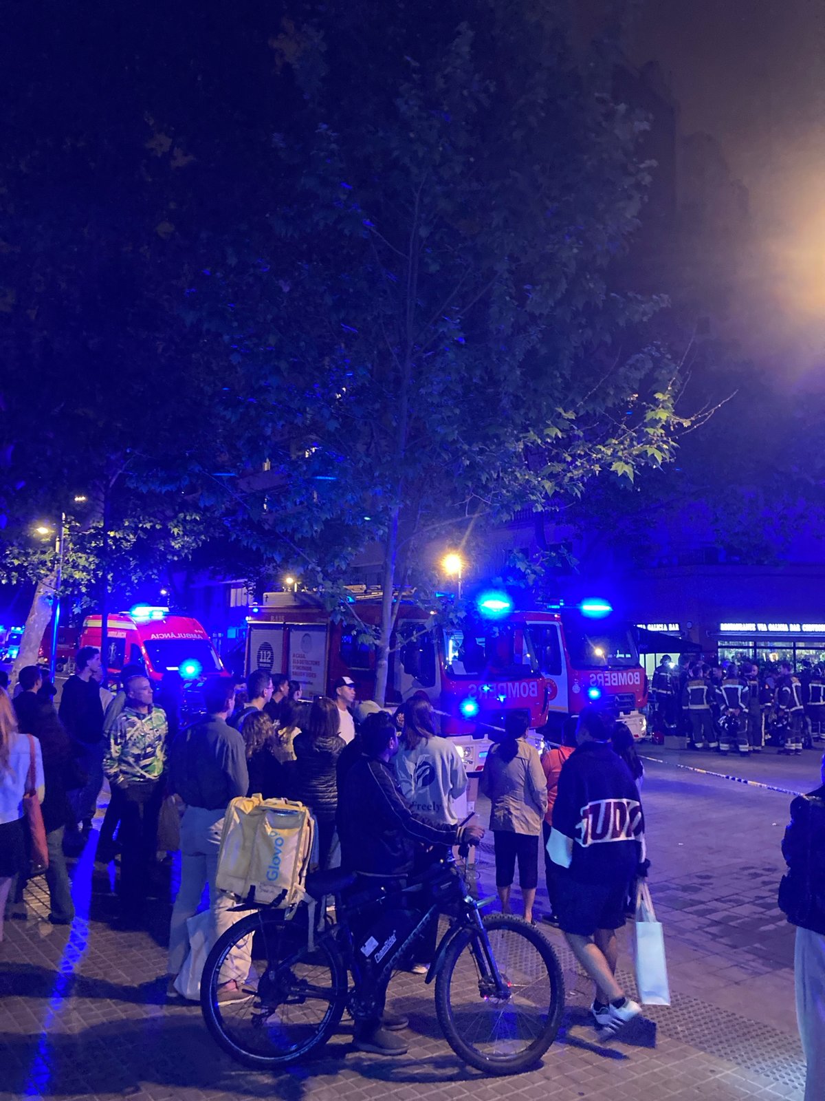 Fire trucks respond to nighttime urban emergency incident