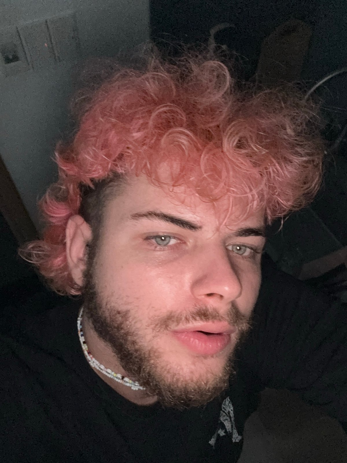 Pink-haired person photographed repeatedly with toys in Đà Nẵng