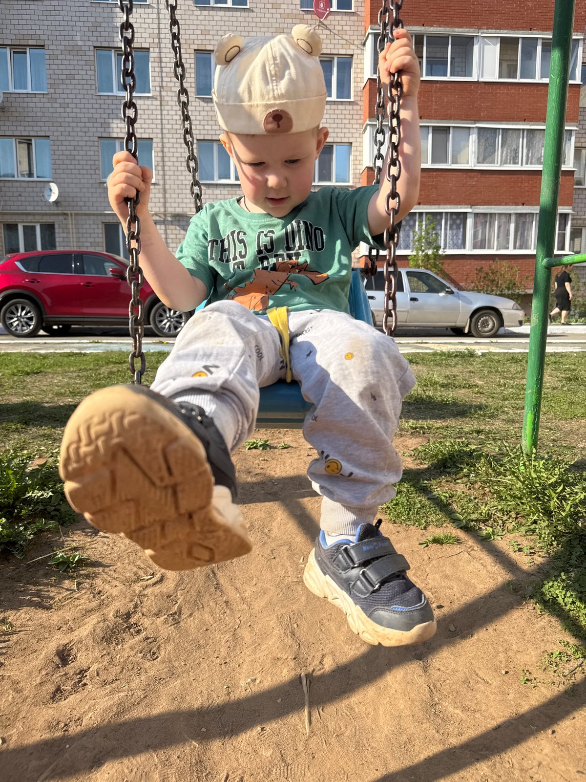 Mother and child enjoy spring afternoon at Russian playground