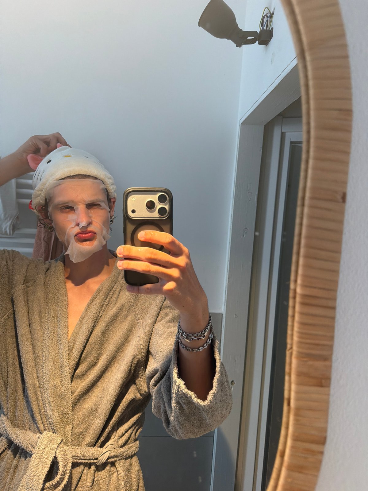 Milan resident takes masked mirror selfie wearing cat ears
