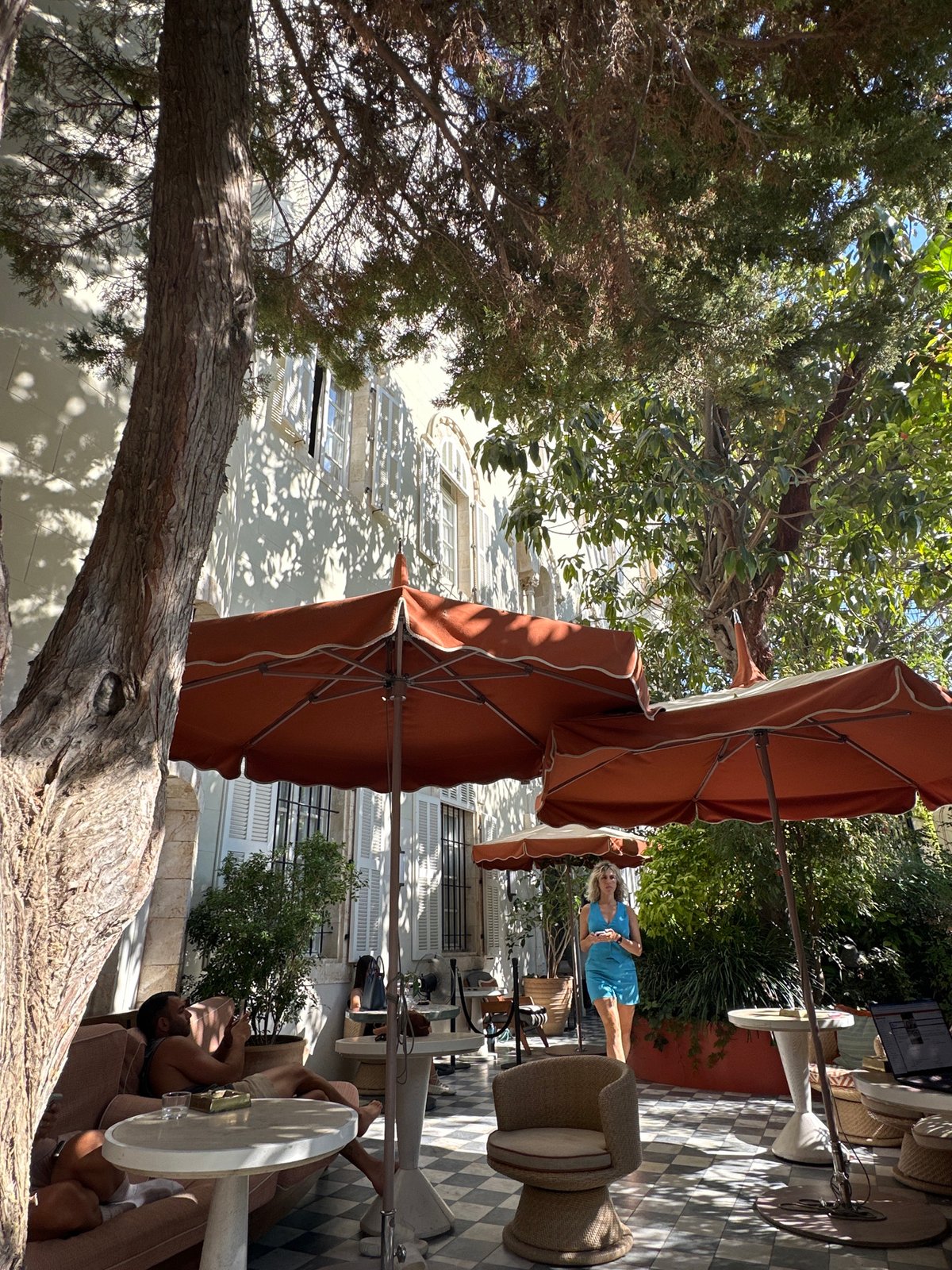 Sunny afternoon at a leafy Tel Aviv courtyard café
