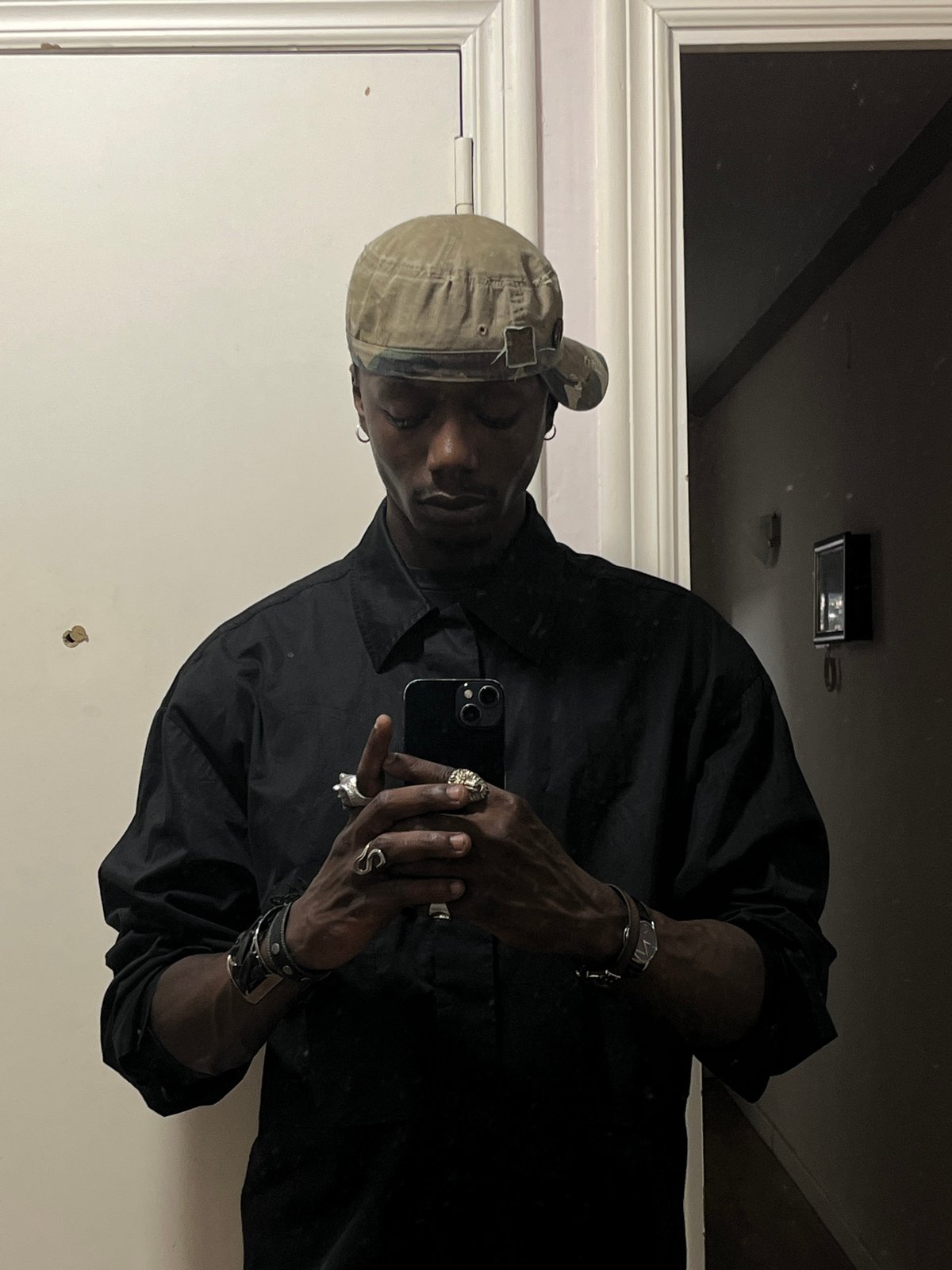 Person takes multiple mirror selfies in Barcelona apartment