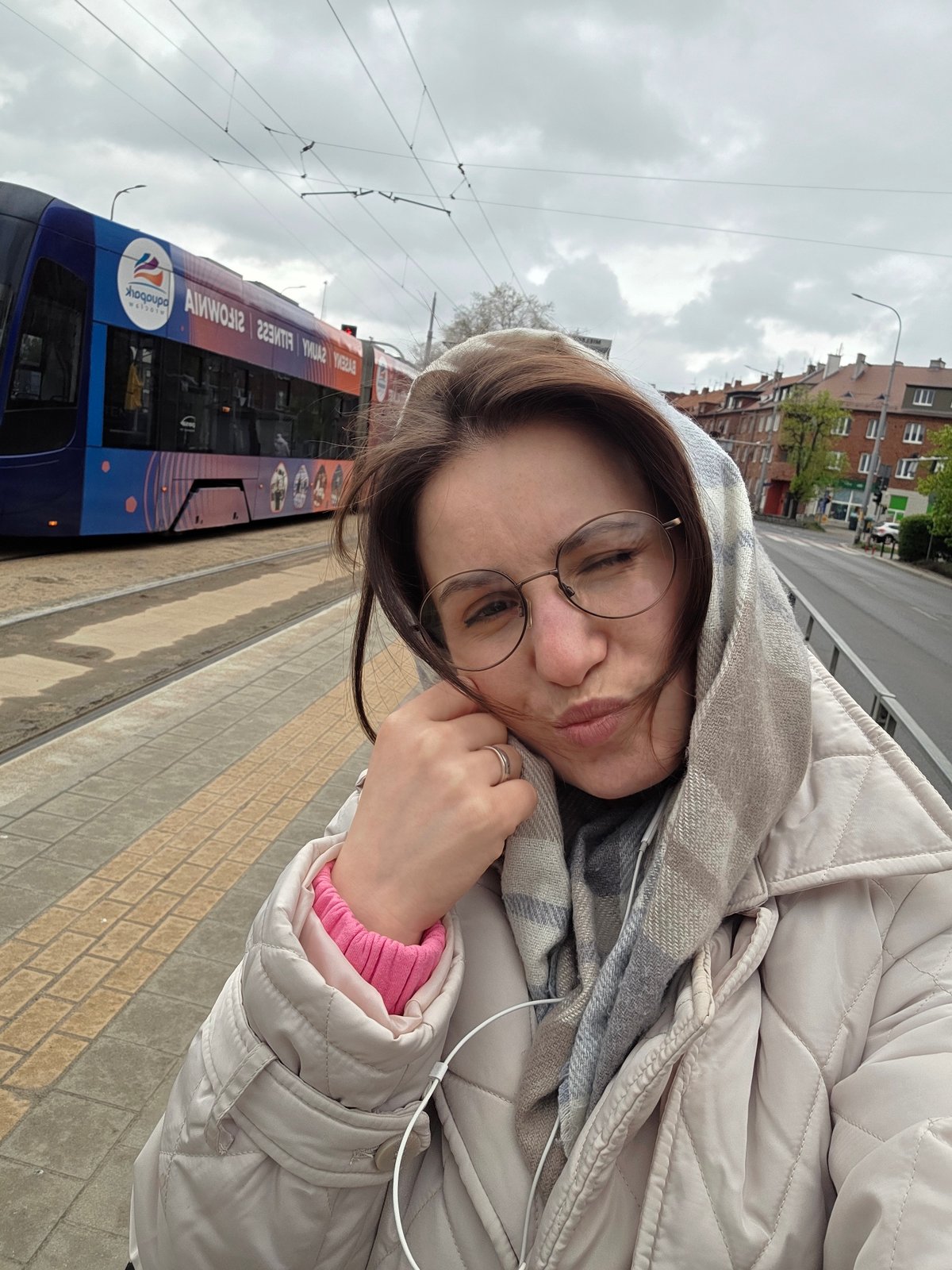 Woman photographed in urban Wrocław on overcast morning