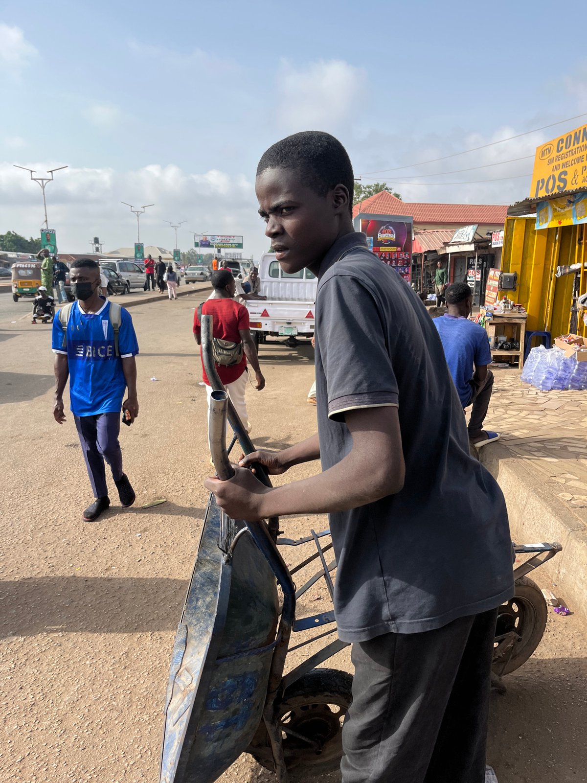 Morning street life unfolds across Nigerian urban centers