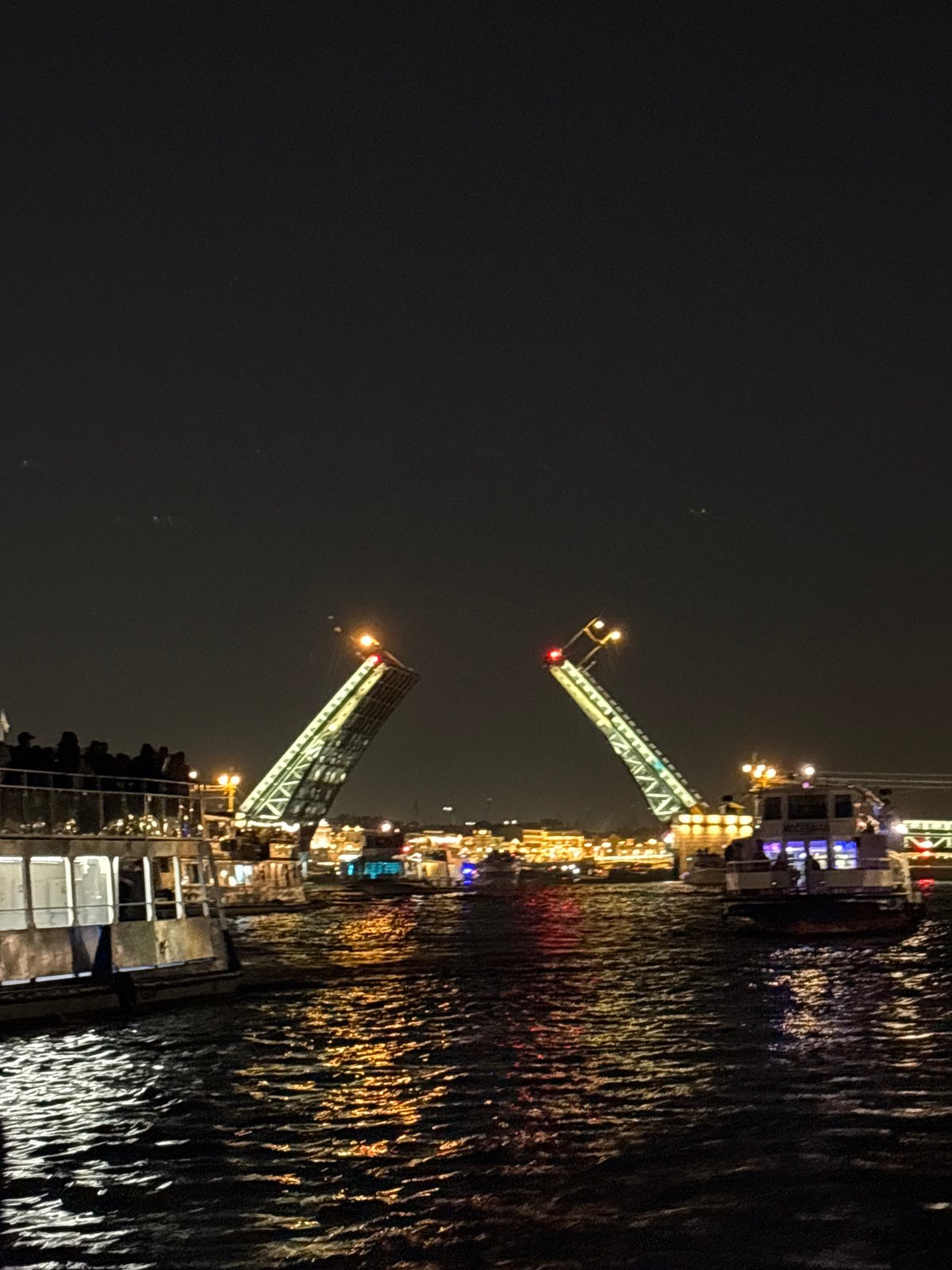 Neva River drawbridge opening draws boats, tourists in Saint Petersburg