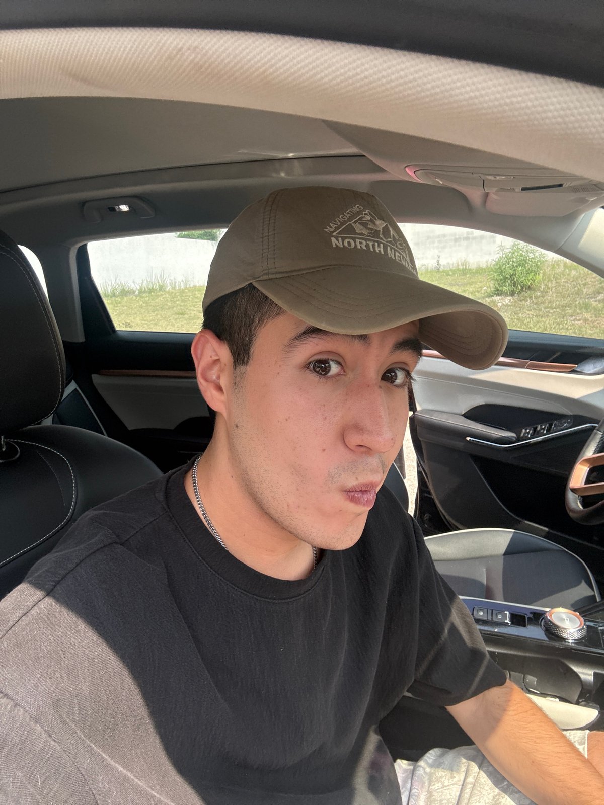 Young man takes selfies in car in Mexico