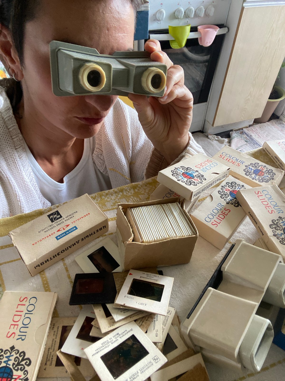 Moscow resident spends quiet morning with vintage slides, dog
