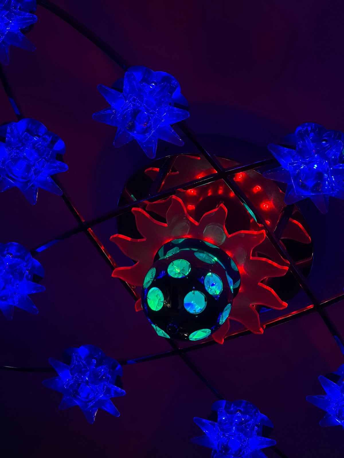 Blue star-shaped decorative lights observed in Perm indoor display