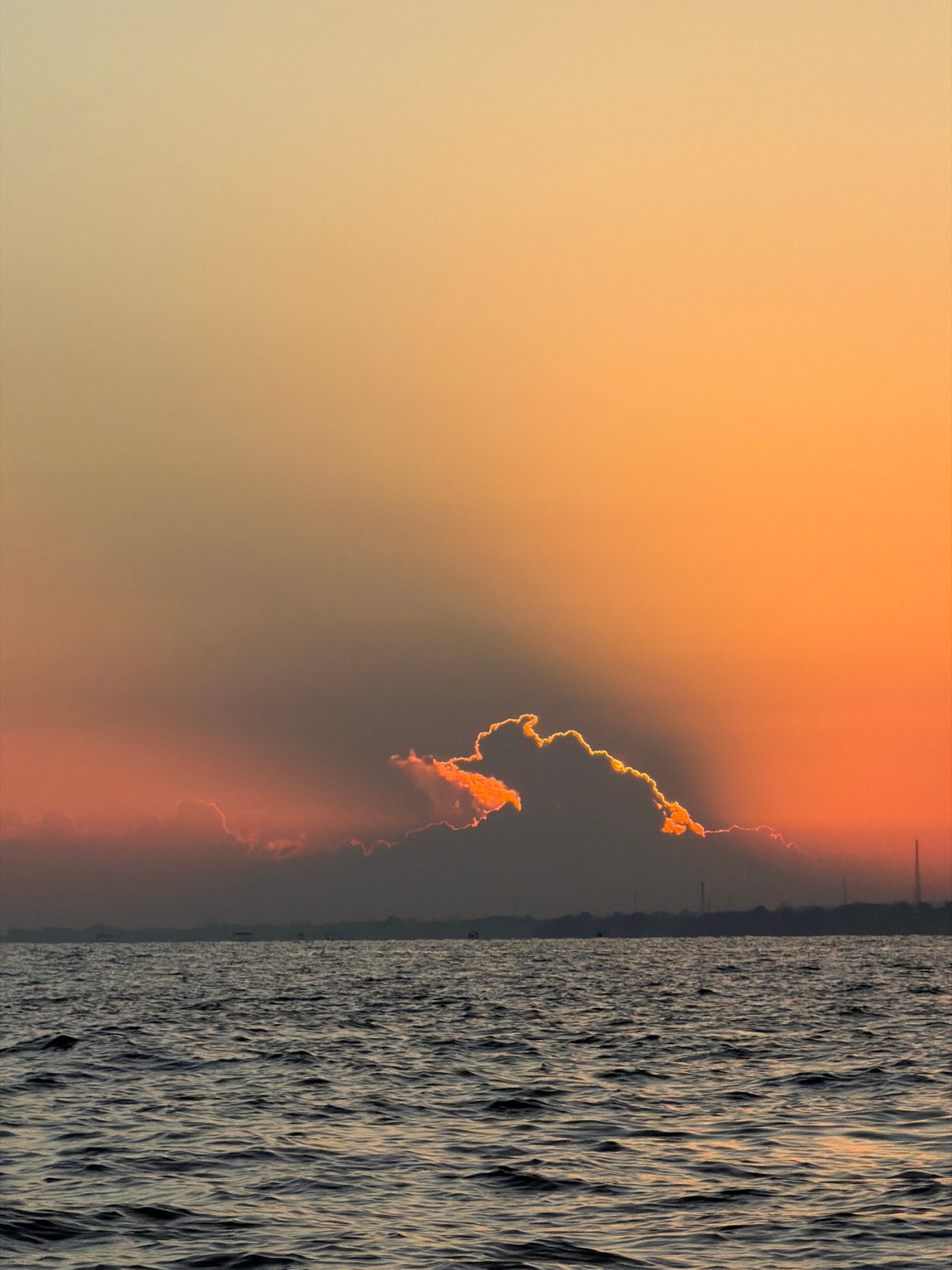 Traditional outrigger boats at sunset off Bali's north coast