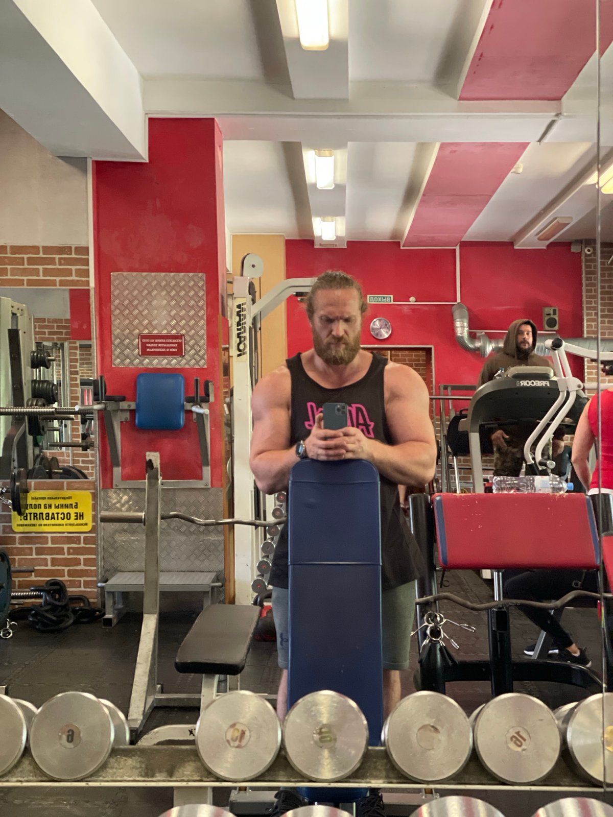 Inside a Saint Petersburg gym, Cyrillic signage on the walls.