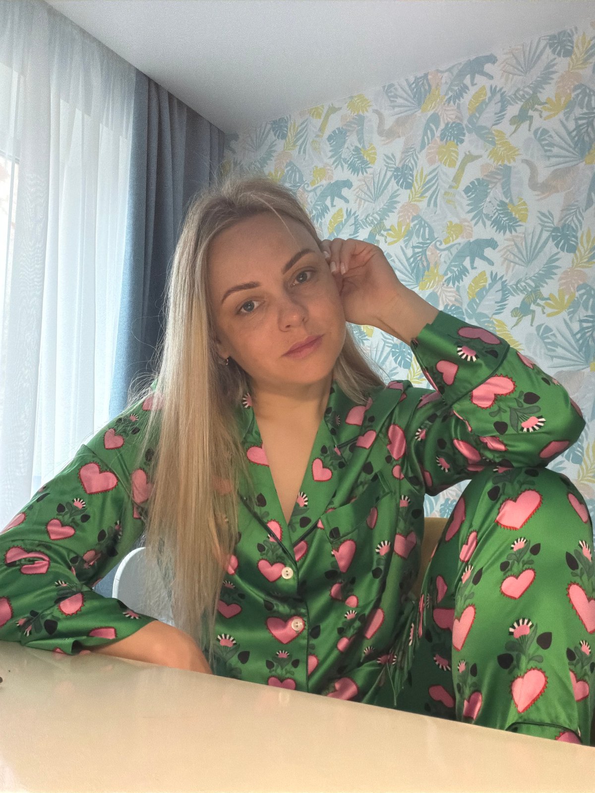 Woman photographed in green pajamas indoors in Votkinsk