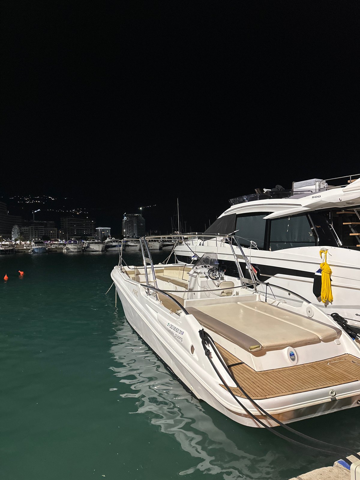 Luxury yachts light up Budva marina on a summer night